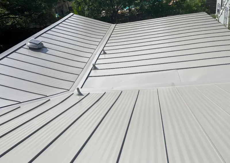 Solar attic fan installed on a metal roof for Roof Ventilation in Idabel